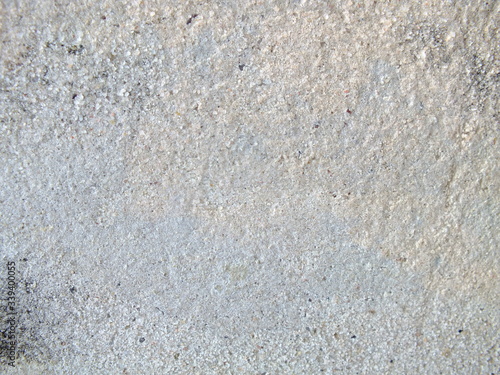macro photo of old gray white rough rough concrete cement surface © Irina