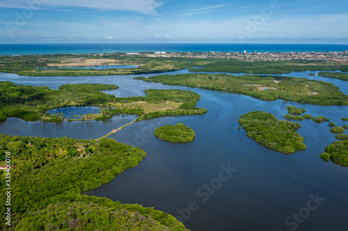 Santa Cruz channel, south of the island of Itamaraca, near Recife, Pernambuco, Brazil on March 1, 2014. Forests, mangroves and coconut trees between the river, forming small islands. Aerial view