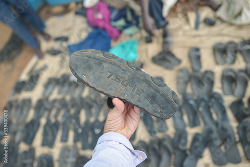 Sandal made from used tires sold at a market in a village in Uganda photo