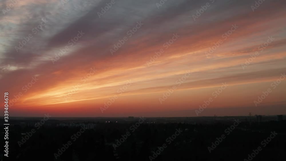 Aerial shot of the impressive moment after the sunset in Finland. Soothing linear cloud formation in the sky with warm golden colors. Aerial shot of the impressive moment after the sunset in Finland. Soothing linear cloud formation in the sky with warm golden colors.