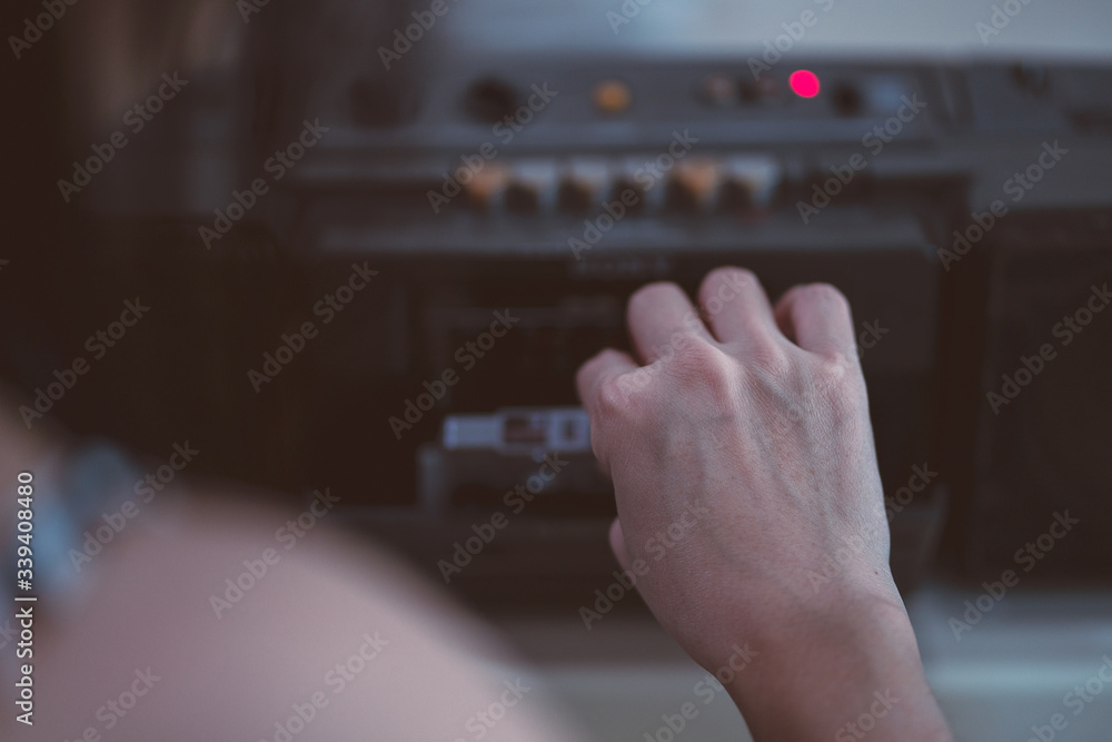 Close up hand to pick tape cassette player.Vintage style Close up hand to pick tape cassette player.Vintage style