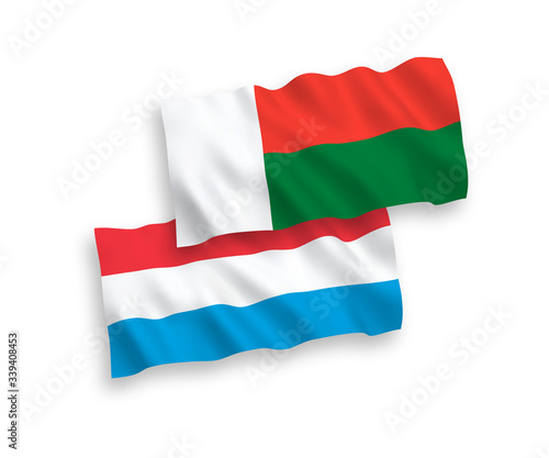 Flags of Madagascar and Luxembourg on a white background