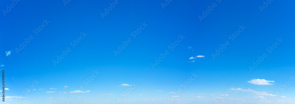 Blue Sky background with tiny Clouds. Panorama background Blue Sky background with tiny Clouds. Panorama background
