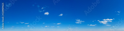 Blue Sky background with tiny Clouds. Panorama background