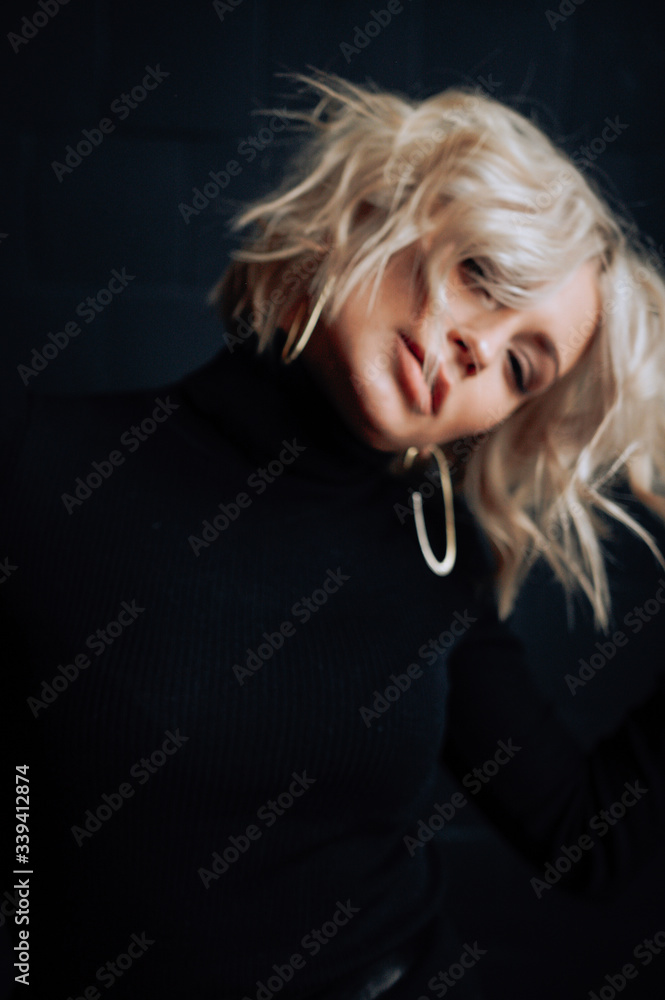 Fashion portrait of beautiful, sexy girl in loft dark interior Fashion portrait of beautiful, sexy girl in loft dark interior