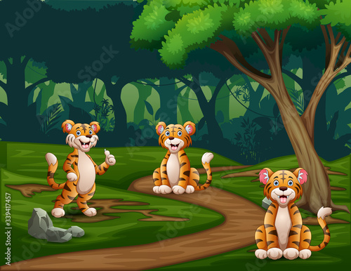 Fototapeta Naklejka Na Ścianę i Meble -  Cartoon three tigers enjoying at forest