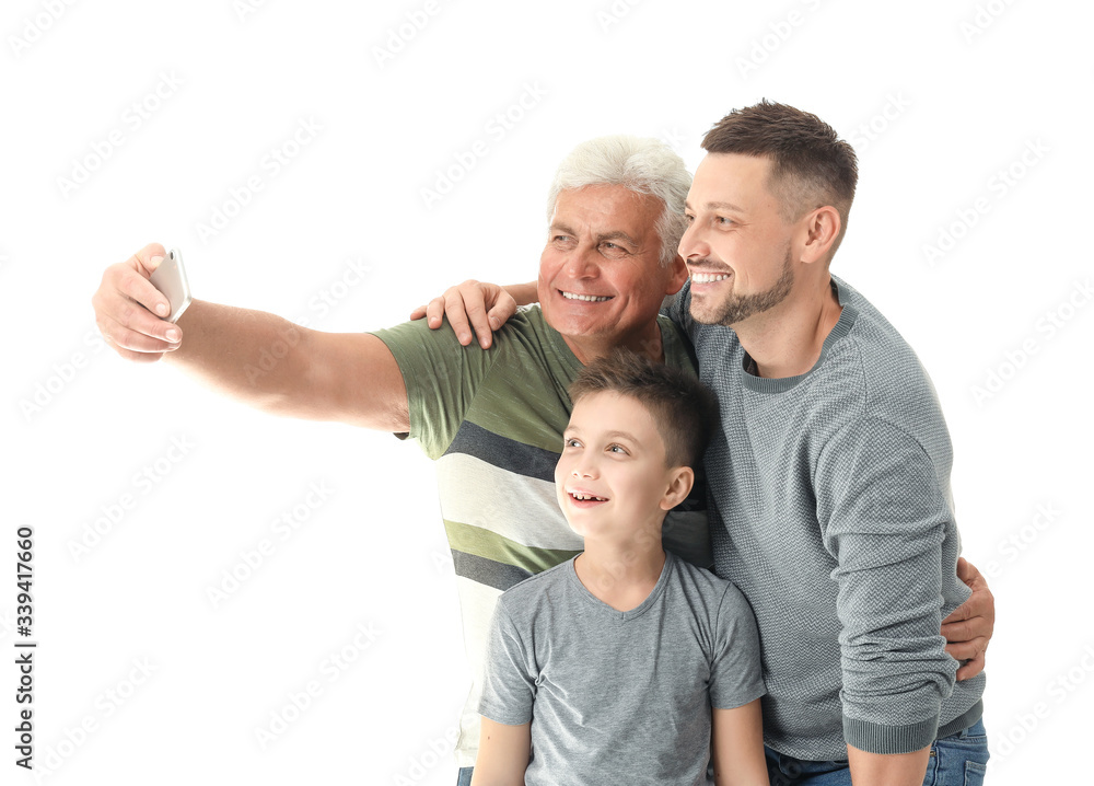 Man with his father and son taking selfie on white background Man with his father and son taking selfie on white background