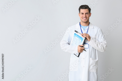 Portrait of young male doct...