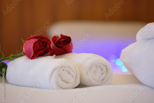 Beautiful spa composition on the bed in a health center and candle spa therapy and atmospheres background