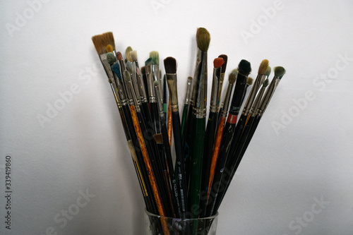 Set of brushes for creativity in a glass tassel up. Used drawing or handmade accessories