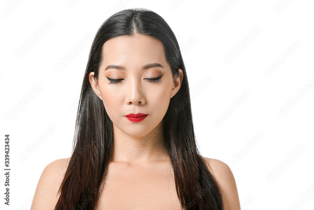 Young Asian woman with beautiful hair on white background Young Asian woman with beautiful hair on white background