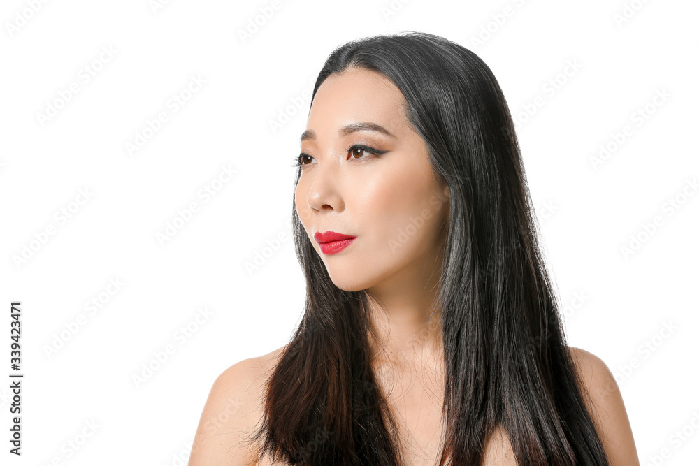 Young Asian woman with beautiful hair on white background Young Asian woman with beautiful hair on white background