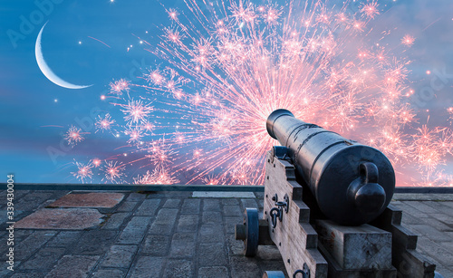Fotografia, Obraz Ramadan Concept - Ramadan kareem cannon with crescent and fireworks - Night sky