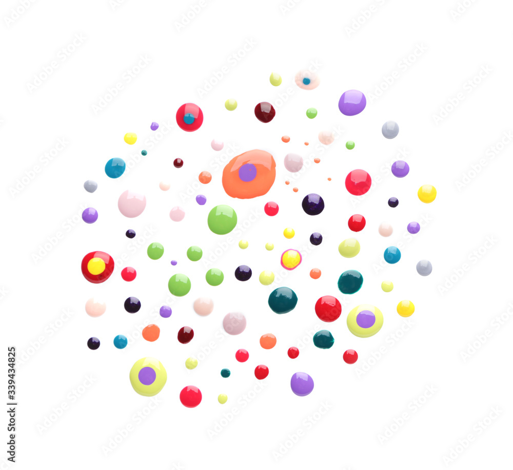 Spilled nail polishes on white background Spilled nail polishes on white background