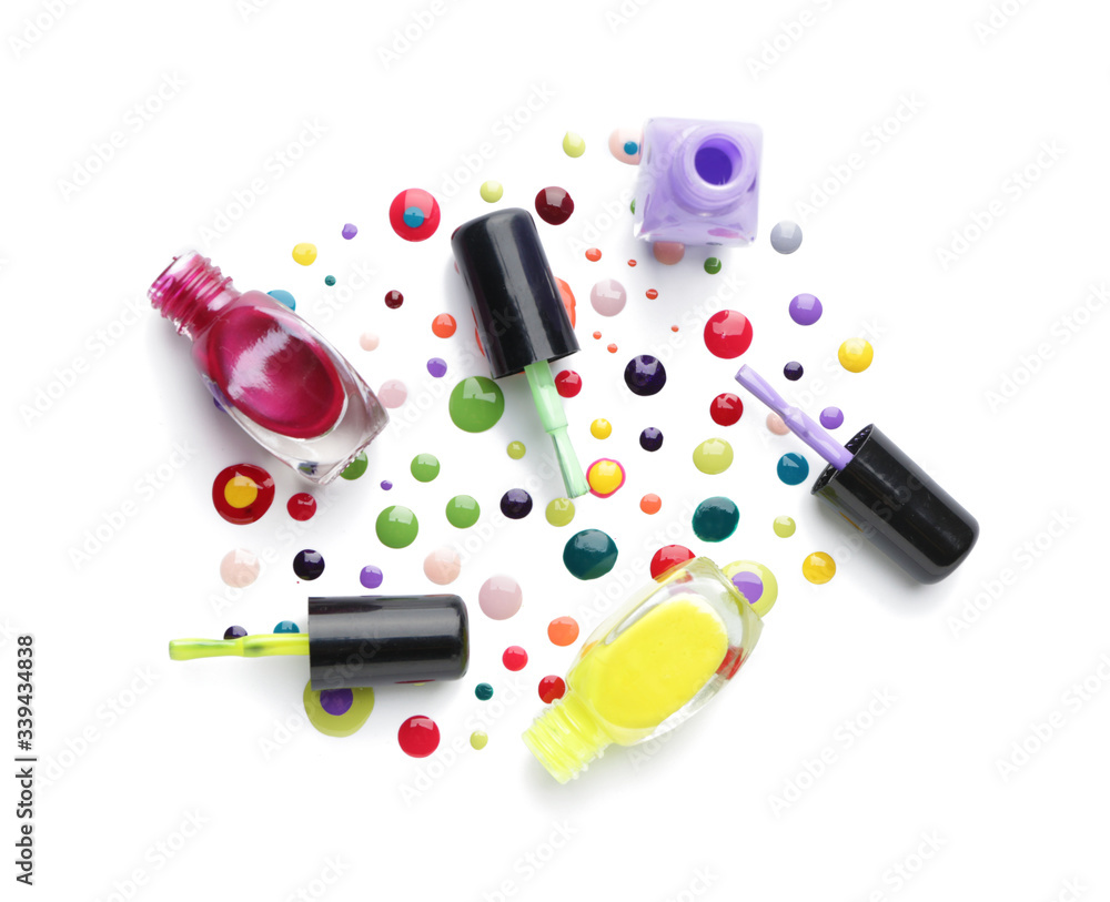 Spilled nail polishes on white background Spilled nail polishes on white background