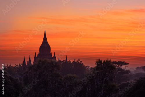 Morning sunrise on a famous buddhist temple with a misty foggy forest in Bagan, Myanmar © Sophie