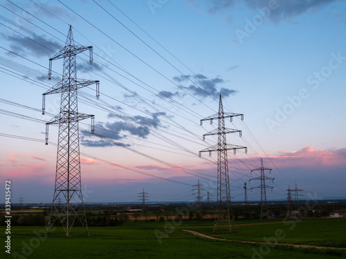 Pylons of a  high-voltage power on a sunset. Electrical industry.