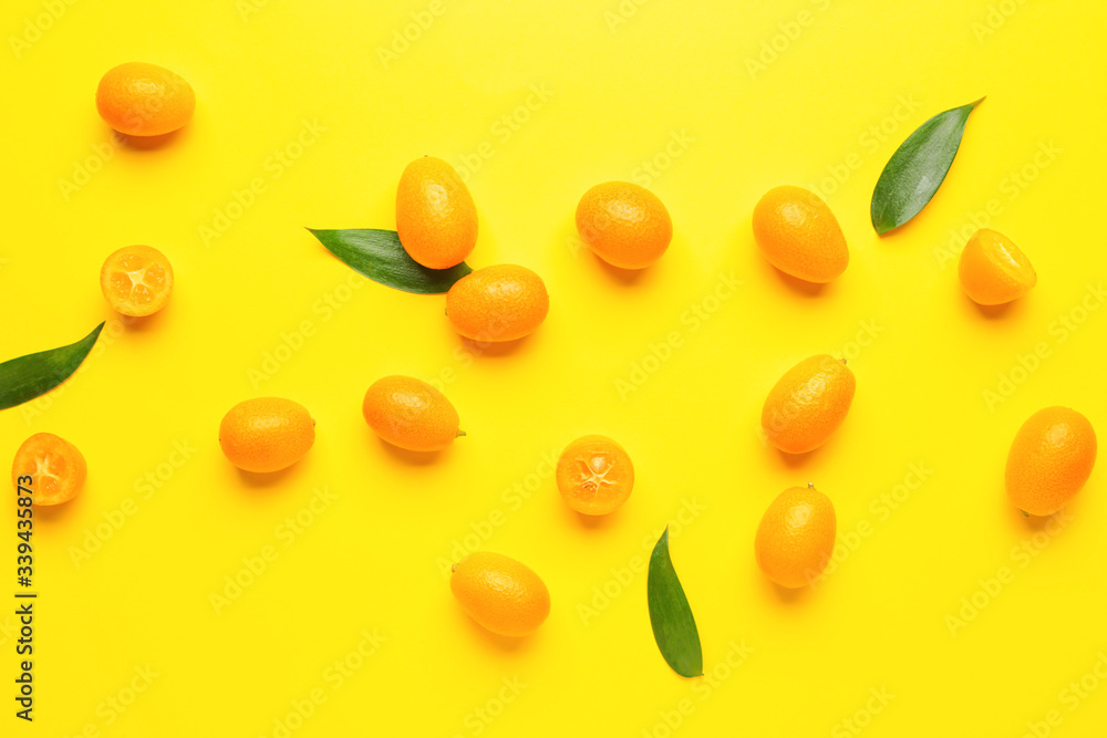 Tasty kumquat fruit on color background Tasty kumquat fruit on color background