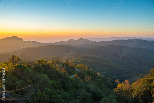 sunrise in the mountains of national park Thailand © Peerawat
