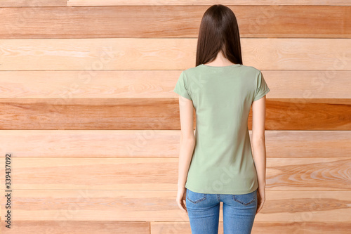 Young woman in blank green ...