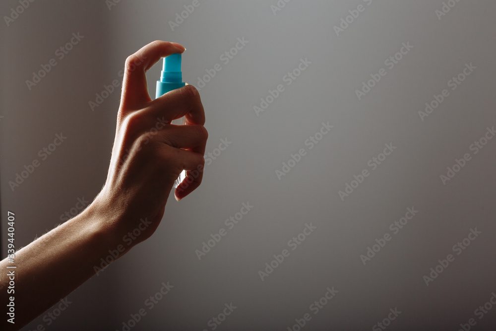 Fototapeta premium Antibacterial spray for hands antiseptic in hands pattern on white background isolation