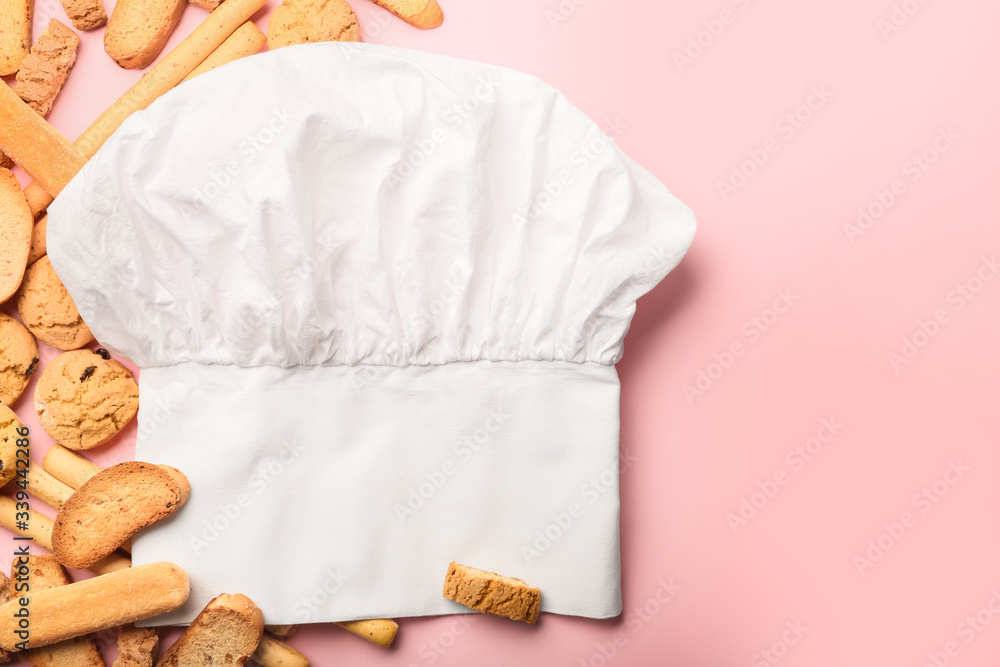 Obraz premium Composition with chef's hat and pastry on color background