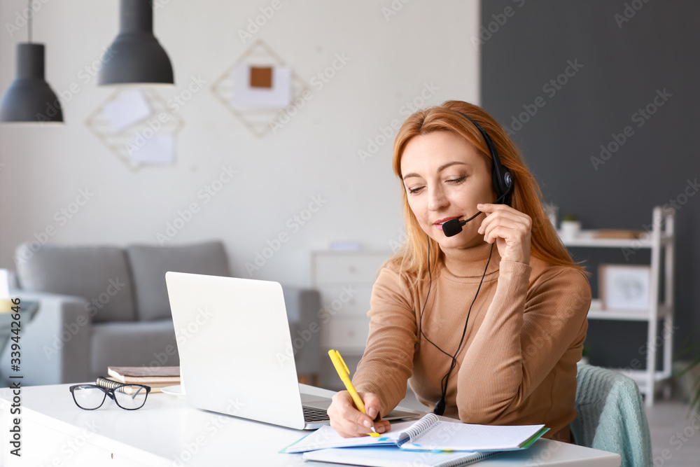 Mature woman using laptop for online learning at home Mature woman using laptop for online learning at home