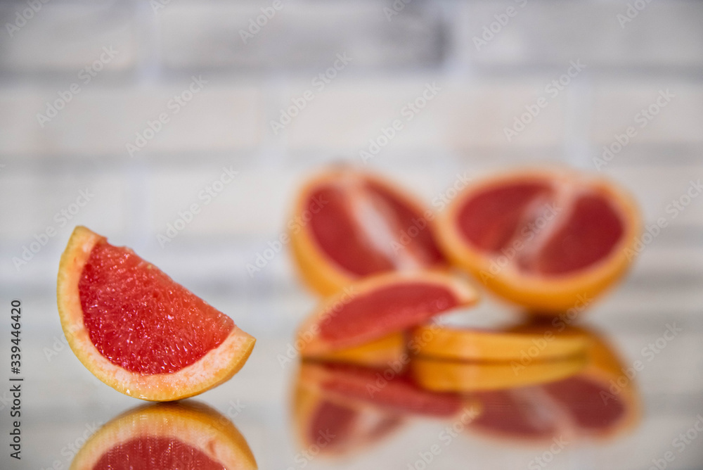 grapefruit slices on a light background close-up grapefruit slices on a light background close-up