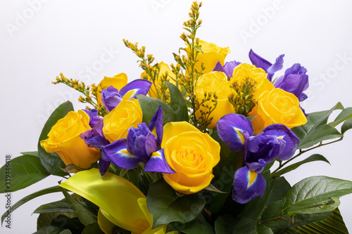 Photography beautiful floristic bouquet of blue irises and yellow roses