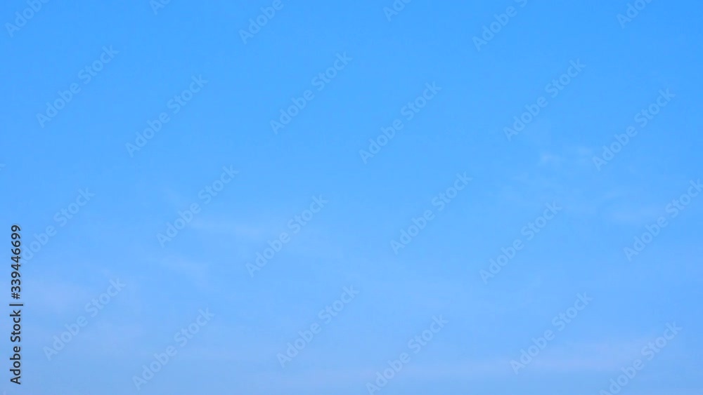 Altostratus bluish-gray sheets wispy of clouds are streak across the blue sky in day light. Altostratus bluish-gray sheets wispy of clouds are streak across the blue sky in day light.