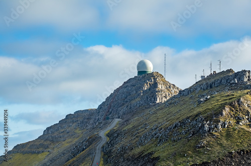 Radar on top of the mountain peak with road