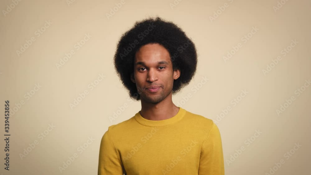 Studio portrait of smiling African man. Shot with RED helium camera in 8K.
