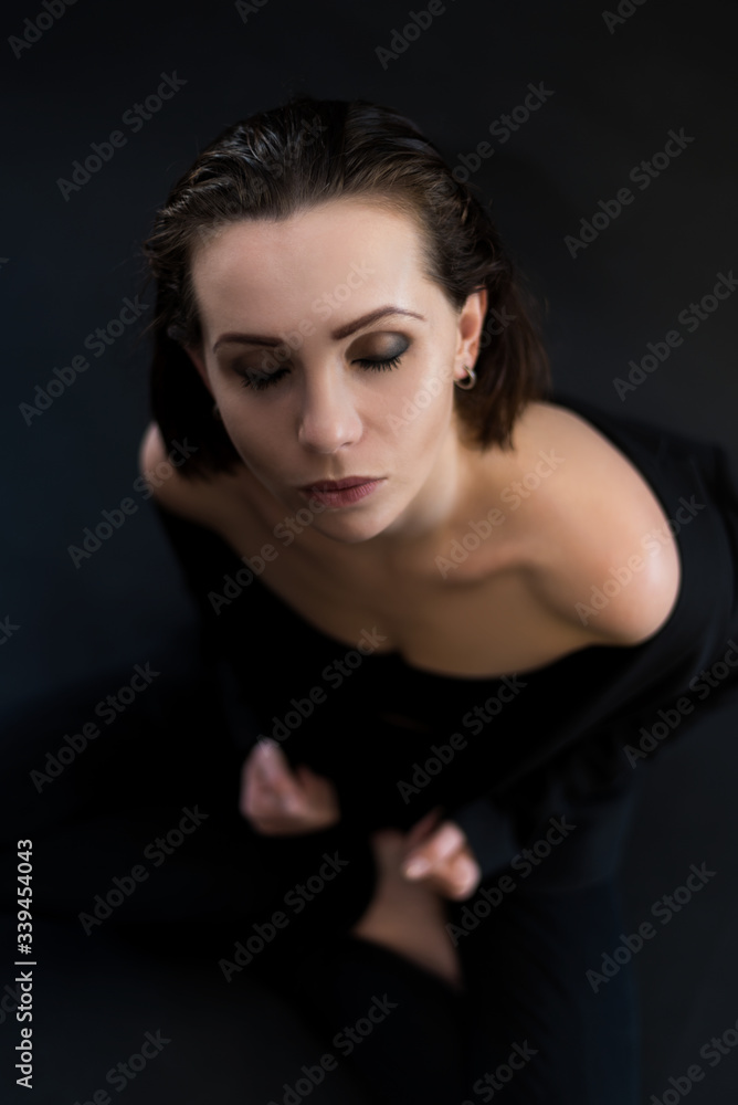 Top view portrait of young woman with closed eyes. Top view portrait of young woman with closed eyes.