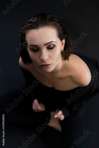 Top view portrait of young woman with closed eyes. © Svetlana Lavereva