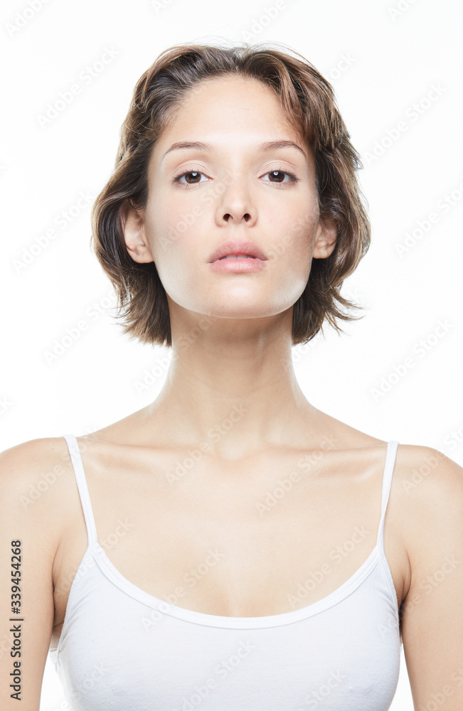 Beautiful woman face close up studio on white Beautiful woman face close up studio on white
