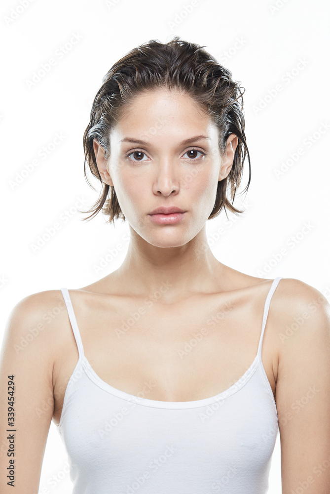 Beautiful woman face close up studio on white Beautiful woman face close up studio on white
