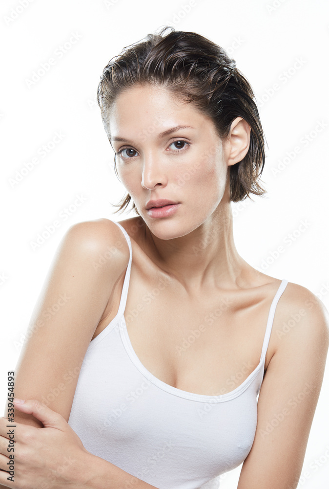 Beautiful woman face close up studio on white Beautiful woman face close up studio on white