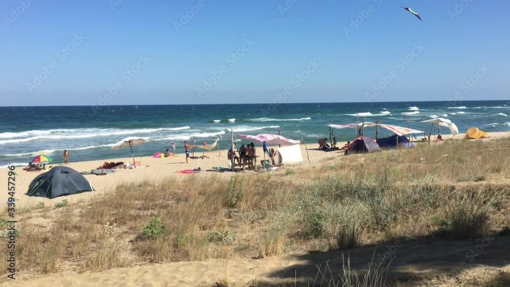Busy beach on a sea shore.