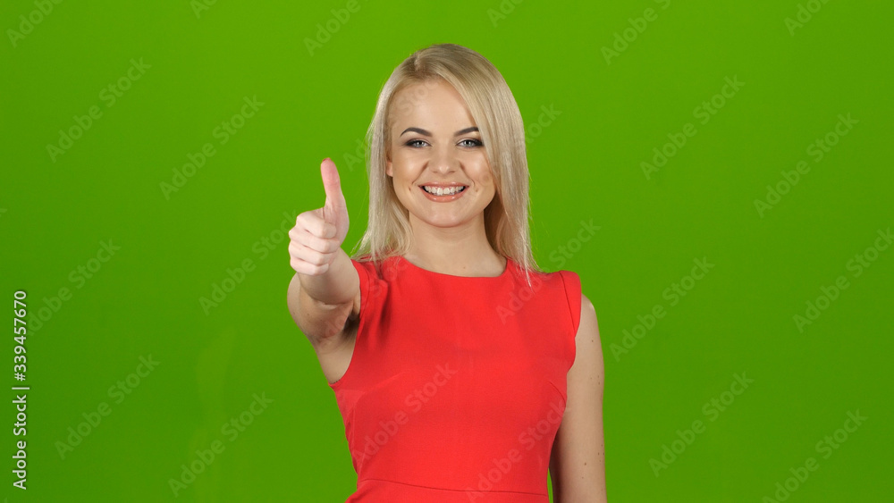 Happy blonde shows gesture all right, like. Studio Happy blonde shows gesture all right, like. Studio