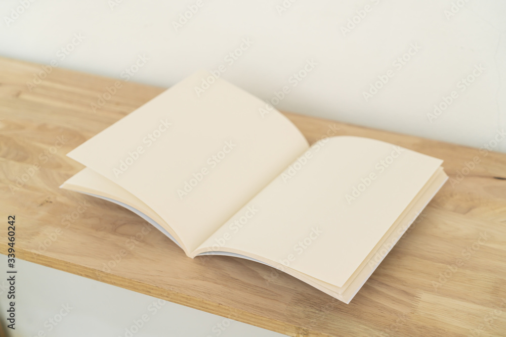 Fototapeta premium Blank catalog, magazines, book on wood background.
