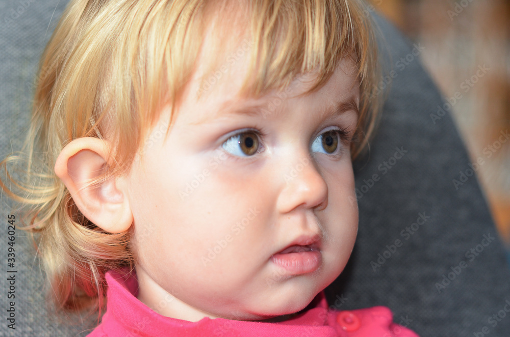 Close up portrait of a cute child watching tv Close up portrait of a cute child watching tv