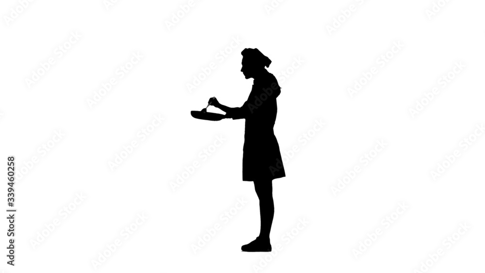 Black silhouette of chef stirring dish in pan and tasting it.