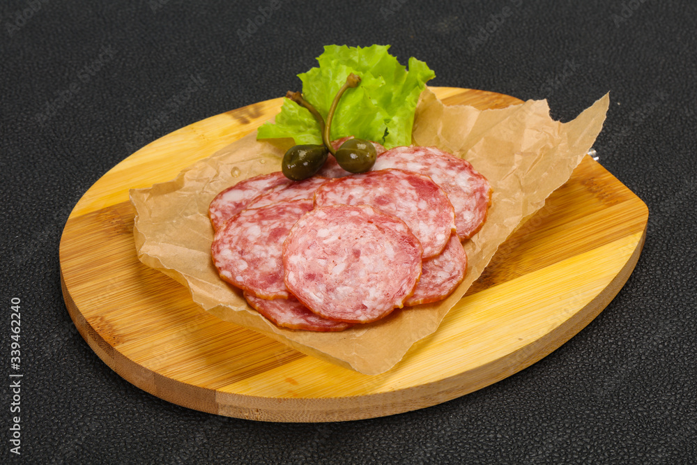 Spanish Salchichon sausage with salad Spanish Salchichon sausage with salad