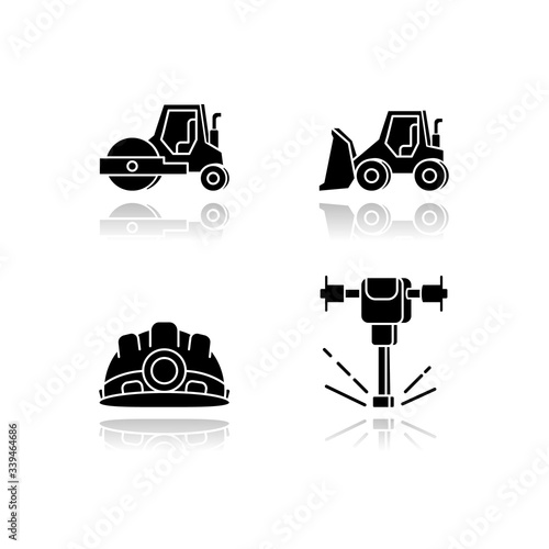 Road works drop shadow black glossy icons set. Bulldozer for construction work. Roller truck for paving. Laying asphalt. Builder equipment. Isolated vector illustrations on white space