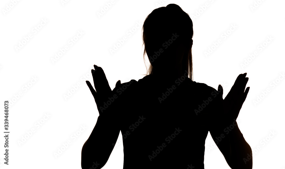 silhouette of young woman figure showing palm of hand gesture stop on white isolated background