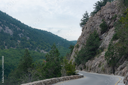 Mountain serpentine in the Crimea. Road in the mountains. Beautiful landscape with road. Landscape with forest and road on a cloudy day