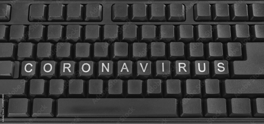 Text on PC keyboard - Coronavirus. Quarantine. Coronavirus pandemic in the world. Text on PC keyboard - Coronavirus. Quarantine. Coronavirus pandemic in the world.