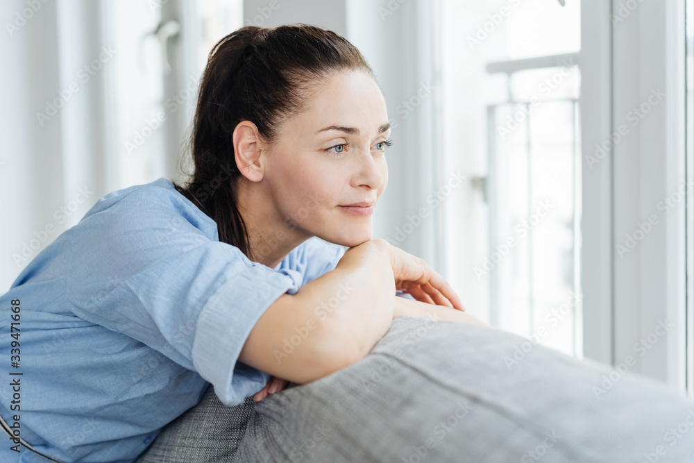 Thoughtful woman relaxing quietly at home Thoughtful woman relaxing quietly at home
