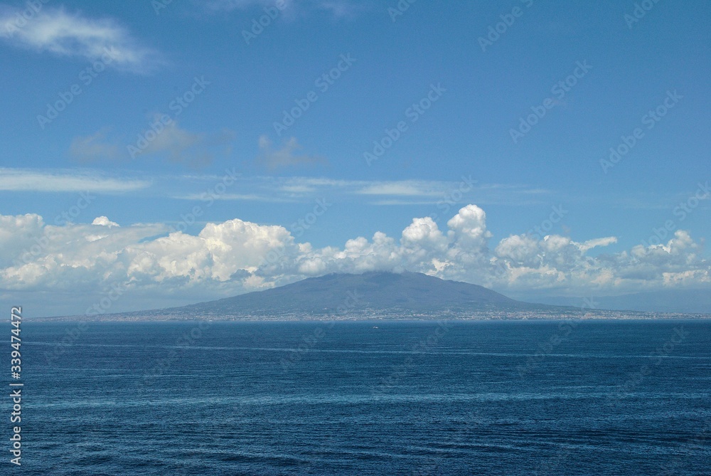 Fototapeta premium Volcano Vesuvius panorama Pompeii old Italian town ruins mystical history tragedy memory clouds blue sea sky background