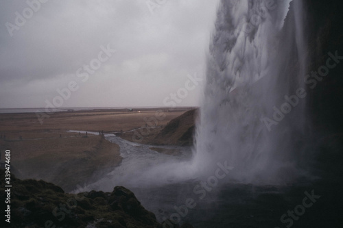 Behind famous Seljalandsfoss waterfall on south Iceland